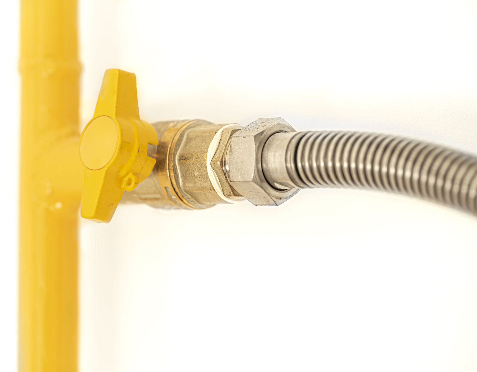 Home Yellow gas pipe with a valve White background