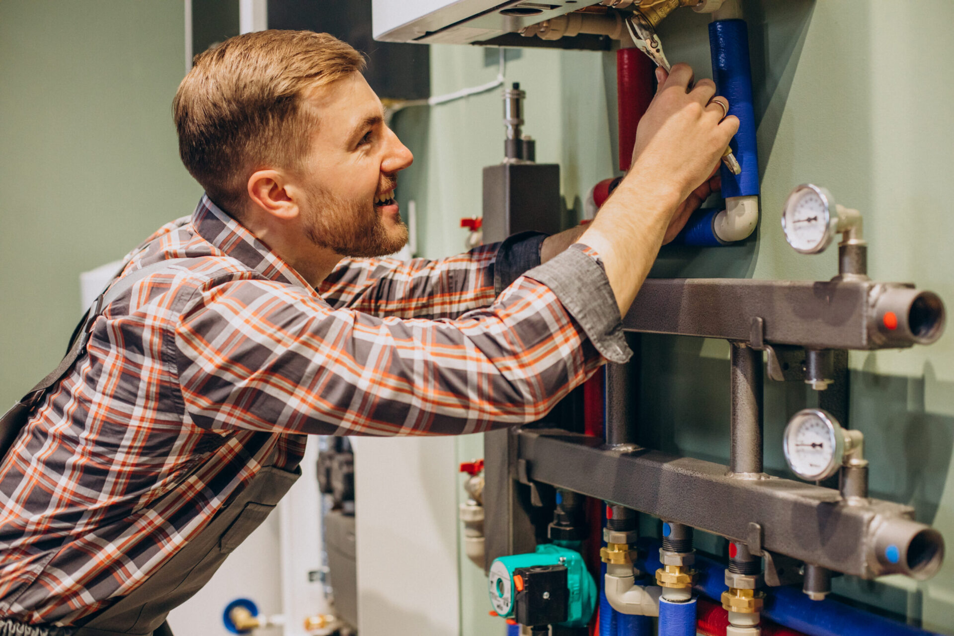 Home Young engineer adjusting autonomous heating