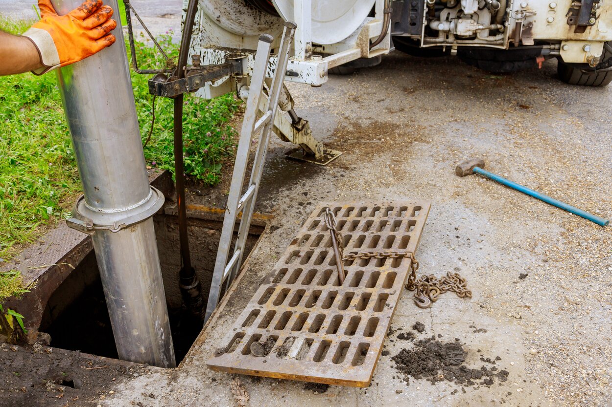 Home Professional plumbers working on an open sewer to address common sewer problems, showcasing sewer line repair, maintenance, and plumbing services. Flow Pro Plumbing offers expert sewer solutions, including sewer inspections, drain cleaning, and repairs to prevent plumbing issues like clogs and backups. We offer reliable solutions to sewer problems, how to prevent sewer line issues, sewer line maintenance, common sewer problems, sewer repairs, clogged sewer lines, sewer cleaning services, sewer inspection, drain cleaning services, plumbing services near me, sewer backup prevention, sewer pipe repair, trenchless sewer repair, plumbing experts near me, professional plumbing services, residential sewer repairs, prevent sewer clogs, emergency plumbing services, affordable sewer repairs, Flow Pro Plumbing sewer services, fix sewer problems near me, plumbing company near me, expert sewer repairs, sewer problem solutions near me, plumbing maintenance services near me.