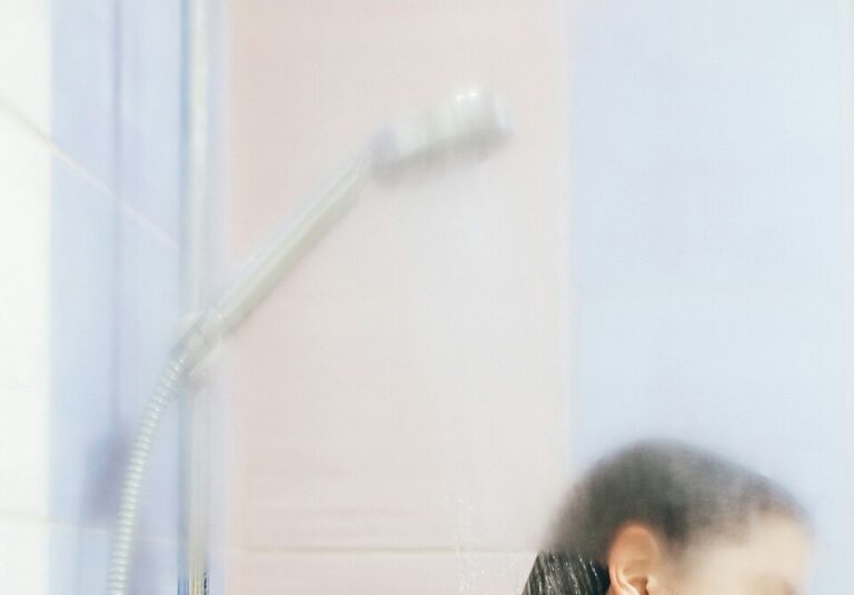 Person enjoying a hot shower, highlighting the benefits of switching to a tankless water heater, with keywords related to energy efficiency, instant hot water, water heater installation, tankless water heater benefits, water heater replacement, plumbing services, professional water heater installation, energy-saving water heaters, and expert plumbing near me by Flow Pro Plumbing. Contact us today for tankless water heater installation, tankless water heater benefits, energy-efficient water heaters, water heater replacement, instant hot water, professional water heater installation, tankless water heater repair, energy-saving water heaters, plumber near me, water heater installation near me, plumbing services near me, water heater upgrades, hot water on demand, tankless water heater service, expert plumbing near me, water heater solutions, eco-friendly water heaters, plumbing for tankless heaters, tankless system maintenance, tankless water heater troubleshooting, reliable water heater services.
