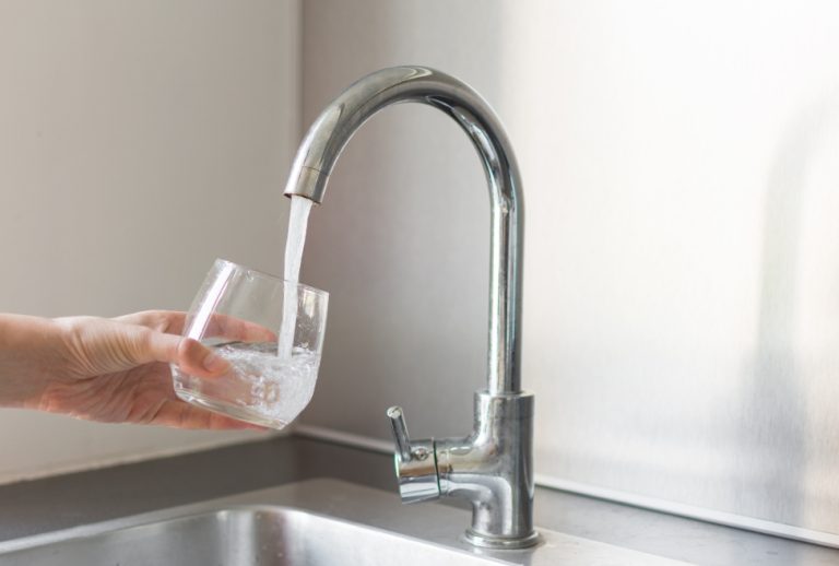 A hand fills a glass of water from the kitchen tap, symbolizing concerns about "is tap water safe to drink." Flow Pro Plumbing provides expert water filtration services in Brentwood, Concord, Oakley, and nearby areas to ensure clean, safe drinking water for your home. Call now for help with Is tap water safe to drink, tap water safety near me, is it safe to drink tap water in Brentwood, water filtration services near me, tap water quality concerns, how safe is tap water, best water filtration systems near me, safe drinking water solutions, local water safety experts, water purification near me, water quality testing near me, clean drinking water services, tap water contamination issues, professional water filtration installation, tap water safety in Concord, water treatment systems near me, reliable plumbing services for water quality, home water filtration experts, water softeners near me, water filtration in Oakley, safe tap water for homes near me. We are available for Water Filtration Installation Antioch, Water Filtration Installation Bethel Island, Water Filtration Installation Brentwood, Water Filtration Installation Byron, Water Filtration Installation Concord, Water Filtration Installation Pleasant Hill, Water Filtration Installation Knightsen, Water Filtration Installation Oakley, Water Filtration Installation Pittsburg, Water Filtration Installation Walnut Creek, Water Filtration Installation Discovery Bay, Water Filtration Installation Bay Point, Water Filtration Installation Clayton.