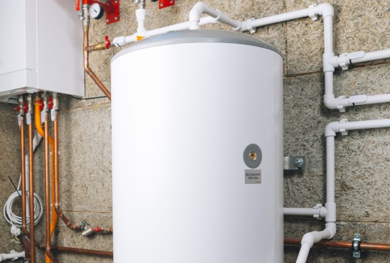 Residential water heater installed in utility room, showing proper setup for routine maintenance and draining; Flow Pro Plumbing provides expert water heater repair, maintenance, and flushing services to help homeowners know how often to drain water heaters and prevent sediment buildup. Contact us today for help with how often to drain water heater, how often should you flush a water heater, water heater maintenance tips, water heater flush service, how to flush a water heater, when to drain water heater, water heater sediment removal, hot water heater cleaning, water heater flush near me, water heater maintenance near me, tankless water heater maintenance, water heater repair services, water heater inspection, water heater tune-up, water heater draining service, local plumber water heater service, residential water heater maintenance, commercial water heater service, drain and flush water heater, professional water heater maintenance Brentwood CA, water heater service Oakley, Antioch water heater experts, water heater maintenance Discovery Bay, Pittsburg CA water heater repair, water heater flushing near Byron CA.