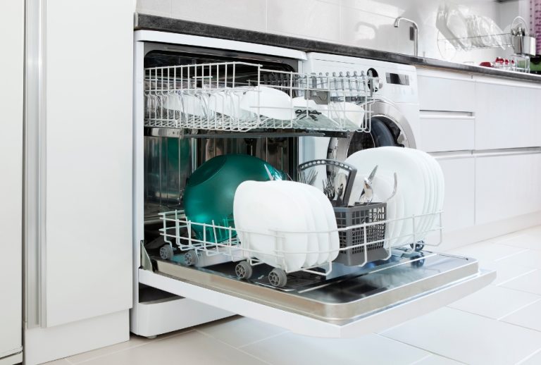 Open dishwasher with clean dishes in a modern kitchen, representing average dishwasher lifespan, when to replace a dishwasher, and common dishwasher issues; Flow Pro Plumbing offers dishwasher installation, kitchen plumbing services, and appliance water line repair. Trust us today to help you with what is the average lifespan of a dishwasher, how long does a dishwasher last, dishwasher life expectancy, when to replace a dishwasher, common dishwasher problems, dishwasher not cleaning well, dishwasher maintenance tips, dishwasher installation near me, appliance plumbing near me, dishwasher repair near me, Flow Pro Plumbing dishwasher services, water line for dishwasher installation, kitchen plumbing near me, installing a new dishwasher, best time to replace a dishwasher, average years a dishwasher lasts, plumbing for kitchen appliances, dishwasher drain issues, clogged dishwasher fix, noisy dishwasher solutions, local dishwasher hookup service, how to tell if dishwasher needs replacing, plumber for dishwasher installation.